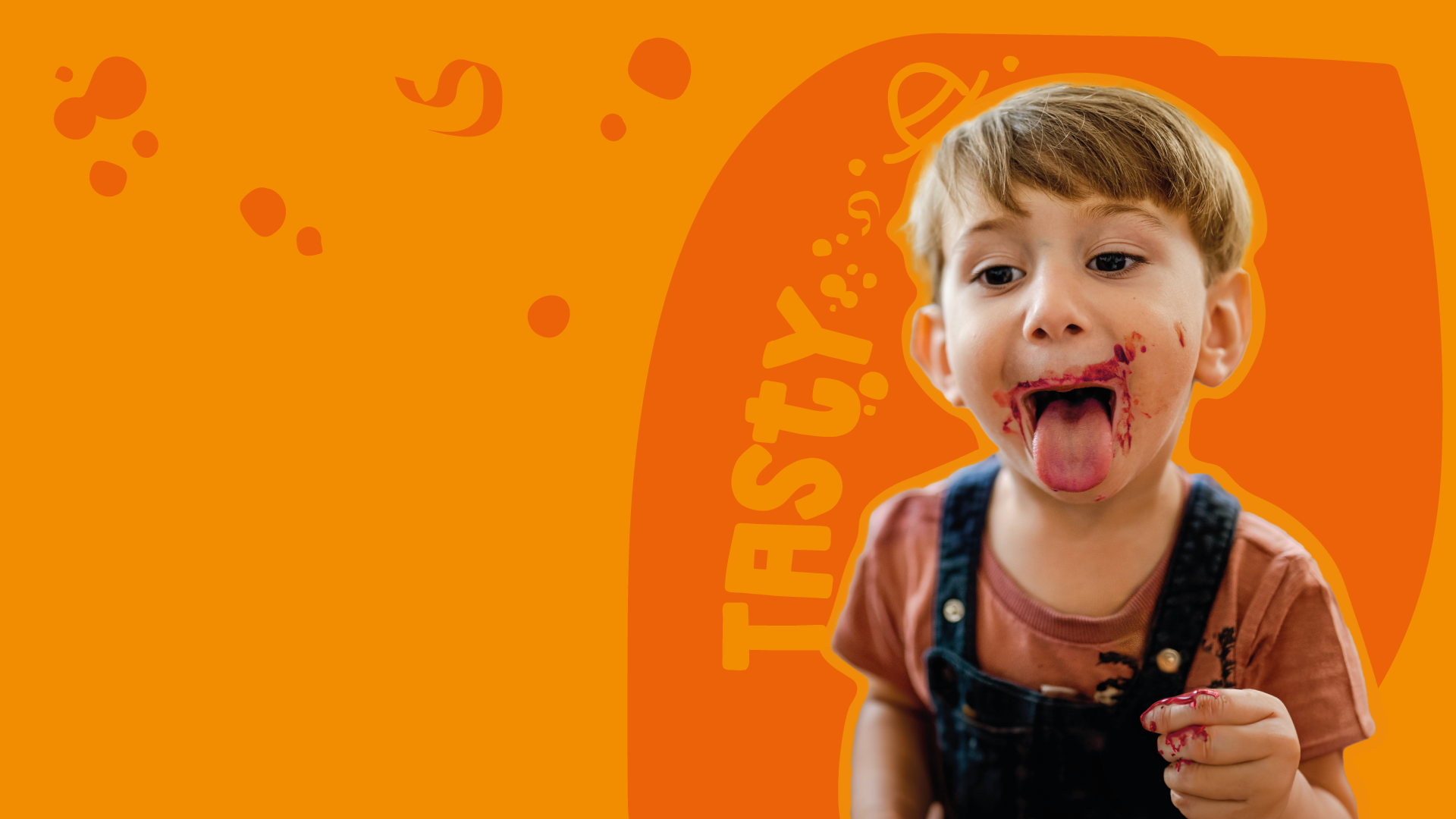 Goodies kid with dirty mouth from eating healthy snacks with orange background