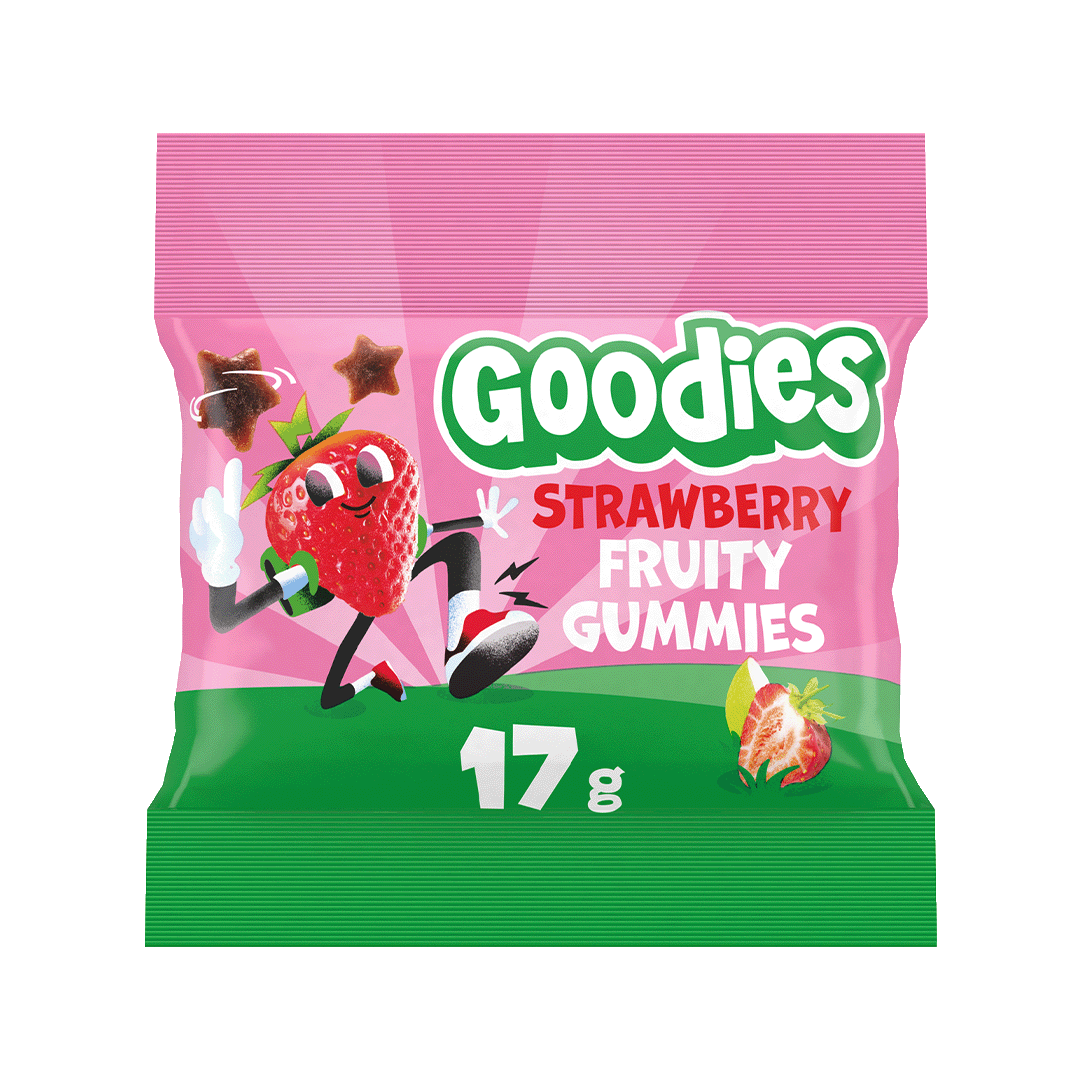 A pink and green packet of Goodies Strawberry Fruity Gummies with a cartoon strawberry character jumping and two star-shaped gummies floating nearby. The text reads “Goodies Strawberry Fruity Gummies” and “17 g”. A sliced strawberry is shown on the bottom right.